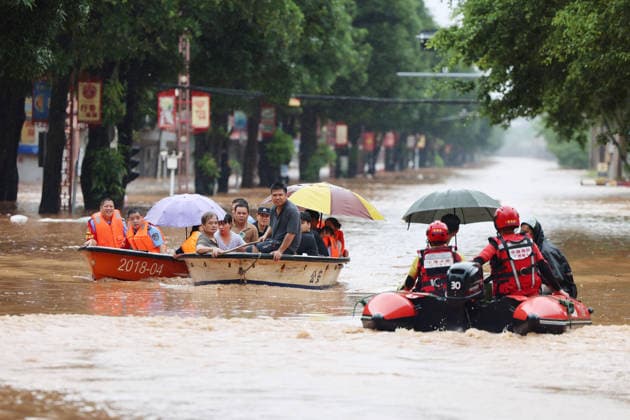 NINGMING, CHINA - AUGUST 23: Residents are evacuated by boat due to flooding caused by a typhoon on August 23, 2026 in Chengzhong Town, Ningming, Guangxi Zhuang Autonomous Region of China. Local authorities organized rescue forces to transfer residents to safe areas.  Copyright: xVCGx 111661654616