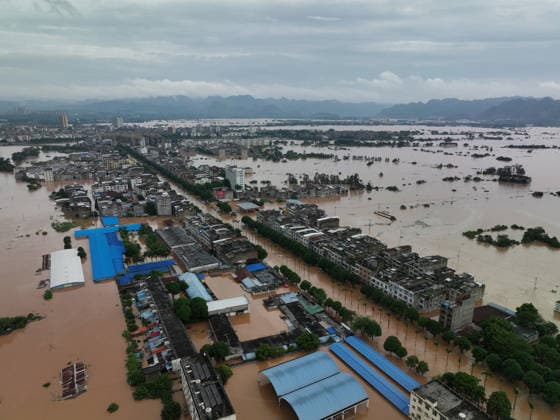 NINGMING, CHINA - AUGUST 23: Residents evacuate as floodwaters hit the area due to a typhoon on August 23, 2026 in Ningming, Guangxi Zhuang Autonomous Region of China. Local authorities organized an orderly transfer of residents affected by the flooding.  Copyright: xVCGx 111661703325