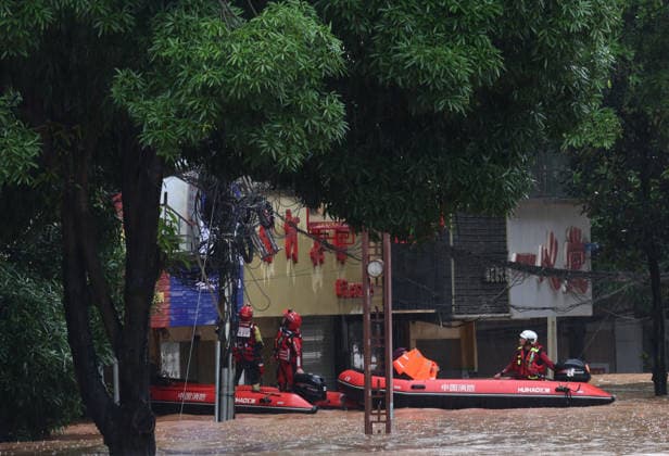 NINGMING, CHINA - AUGUST 23: Rescue workers evacuate residents by boat due to flooding caused by a typhoon on August 23, 2026 in Ningming, Guangxi Zhuang Autonomous Region of China. Local authorities organized rescue teams to inspect hazards and assist trapped residents in Chengzhong Town, Ningming County.  Copyright: xVCGx 111661654622