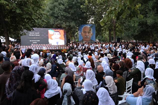 August 23, 2026, Diyarbakir, Turkey: A poster of PKK leader Abdullah Ocalan is seen being hanged, while a video showing the deceased guerrillas is being displayed during the commemoration ceremony. Three days of condolences were established and a memorial program was organized in the city of Diyarbakir in Turkey for 49 Kurdistan Workers Party (PKK) guerrillas who died in armed clashes with the Turkish army on different dates in the past years and whose identities have just been announced. Abdullah Ocalan, the leader of the armed Kurdish PKK party who has been in prison in Turkey for 26 years, had decided two years ago to disarm his party and start peace talks with the state of Turkey. Diyarbakir Turkey  - ZUMAs197 20260823_aaa_s197_383 Copyright: xMehmetxMasumxSuerx