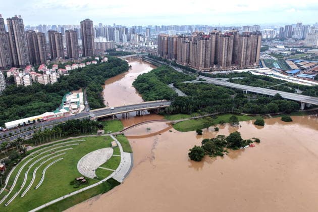 NANNING, CHINA - AUGUST 24: Aerial view of floodwaters submerging riverside park and walkway along the Yong River on August 24, 2026 in Nanning, Guangxi Zhuang Autonomous Region of China. Heavy rainfall brought by Typhoon Narra flooded the low-lying areas in south China s Guangxi Zhuang Autonomous Region.  Copyright: xVCGx 111661812018