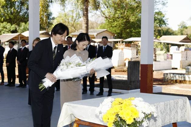 CORRECTED: Japan crown prince, crown princess in Paraguay Japan s Crown Prince Fumihito and Crown Princess Kiko offer flowers at the cenotaph for Japanese settlers in Paraguay on Aug. 23, 2026, in Yguazu during their official trip to the South American country to mark 90 years of Japanese immigration to Paraguay.  A14AA0005626543P