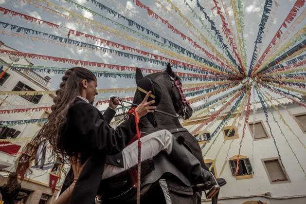 August 24, 2026, Ferreries, Menorca Balearic Islands, Spain: A caixer, or horse rider, rears his horse amid a cheering crowd during the traditional Jaleo at the Sant Bartomeu Festival in Ferreries. Ferreries Spain - ZUMAo105 20260824_fap_o105_025 Copyright: xMatthiasxOesterlex