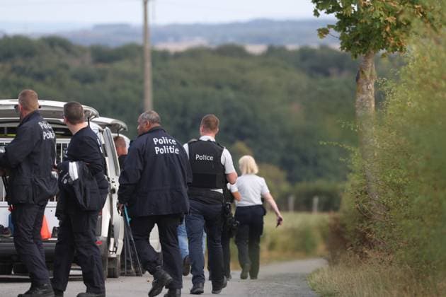 A police vehicle and police forces pictured inside a large security perimeter was set by police around Onhaye soccer club, Monday 24 August 2026, in Onhaye. Public prosecutor office confirmed a dead body was found but nothing more so far.  BRUNOxFAHY 184186755
