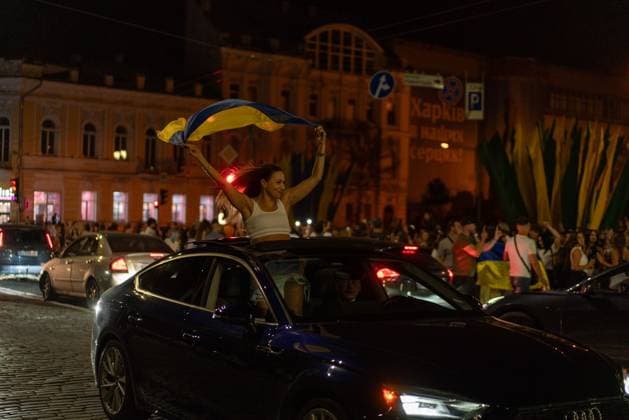 August 24, 2026, Kharkiv, Ukraine: KHARKIV, UKRAINE Ã¢â‚¬ AUGUST 23, 2026: People gather in central Kharkiv, Ukraine, on August 23, 2026, to mark Ukrainian National Flag Day, one day ahead of the countryÃ¢â‚¬â ¢s Independence Day. Residents took part in gatherings featuring Ukrainian flags, music, chants and vehicle processions in the northeastern city, which remains exposed to Russian drone and missile attacks amid the continuing war. Kharkiv Ukraine - ZUMAq101 20260824_zna_q101_077 Copyright: xCarloxBravox