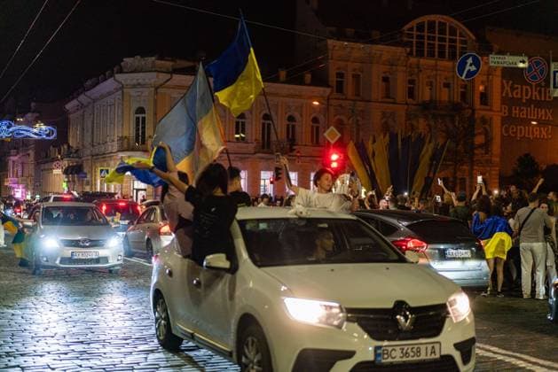August 24, 2026, Kharkiv, Ukraine: KHARKIV, UKRAINE Ã¢â‚¬ AUGUST 23, 2026: People gather in central Kharkiv, Ukraine, on August 23, 2026, to mark Ukrainian National Flag Day, one day ahead of the countryÃ¢â‚¬â ¢s Independence Day. Residents took part in gatherings featuring Ukrainian flags, music, chants and vehicle processions in the northeastern city, which remains exposed to Russian drone and missile attacks amid the continuing war. Kharkiv Ukraine - ZUMAq101 20260824_zna_q101_078 Copyright: xCarloxBravox
