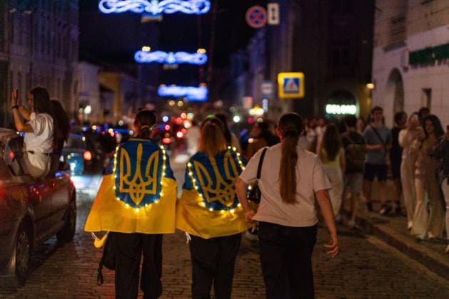 August 24, 2026, Kharkiv, Ukraine: KHARKIV, UKRAINE Ã¢â‚¬ AUGUST 23, 2026: People gather in central Kharkiv, Ukraine, on August 23, 2026, to mark Ukrainian National Flag Day, one day ahead of the countryÃ¢â‚¬â ¢s Independence Day. Residents took part in gatherings featuring Ukrainian flags, music, chants and vehicle processions in the northeastern city, which remains exposed to Russian drone and missile attacks amid the continuing war. Kharkiv Ukraine - ZUMAq101 20260824_zna_q101_087 Copyright: xCarloxBravox