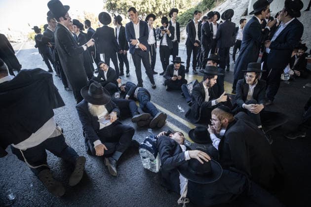 Haredi Jews protest mandatory military service in Bnei Brak BNEI BRAK, ISRAEL - AUGUST 24: Ultra-Orthodox Jews, known as Haredim, gather to protest mandatory military service, blocking one of the city s main roads in Bnei Brak near Tel Aviv, Israel on August 24, 2026. The protesters, wearing traditional black suits, white shirts and black hats, demonstrate against a government bill that proposes fines and other sanctions for those refusing military service. Mostafa Alkharouf Anadolu Bnei Brak Israel. Editorial use only. Please get in touch for any other usage.  Copyright: x2026xAnadoluxMostafaxAlkharoufx
