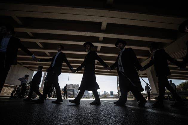 Haredi Jews protest mandatory military service in Bnei Brak BNEI BRAK, ISRAEL - AUGUST 24: Ultra-Orthodox Jews, known as Haredim, gather to protest mandatory military service, blocking one of the city s main roads in Bnei Brak near Tel Aviv, Israel on August 24, 2026. The protesters, wearing traditional black suits, white shirts and black hats, demonstrate against a government bill that proposes fines and other sanctions for those refusing military service. Mostafa Alkharouf Anadolu Bnei Brak Israel. Editorial use only. Please get in touch for any other usage.  Copyright: x2026xAnadoluxMostafaxAlkharoufx