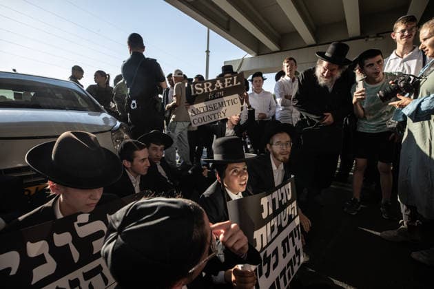 Haredi Jews protest mandatory military service in Bnei Brak BNEI BRAK, ISRAEL - AUGUST 24: Ultra-Orthodox Jews, known as Haredim, gather to protest mandatory military service, blocking one of the city s main roads in Bnei Brak near Tel Aviv, Israel on August 24, 2026. The protesters, wearing traditional black suits, white shirts and black hats, demonstrate against a government bill that proposes fines and other sanctions for those refusing military service. Mostafa Alkharouf Anadolu Bnei Brak Israel. Editorial use only. Please get in touch for any other usage.  Copyright: x2026xAnadoluxMostafaxAlkharoufx