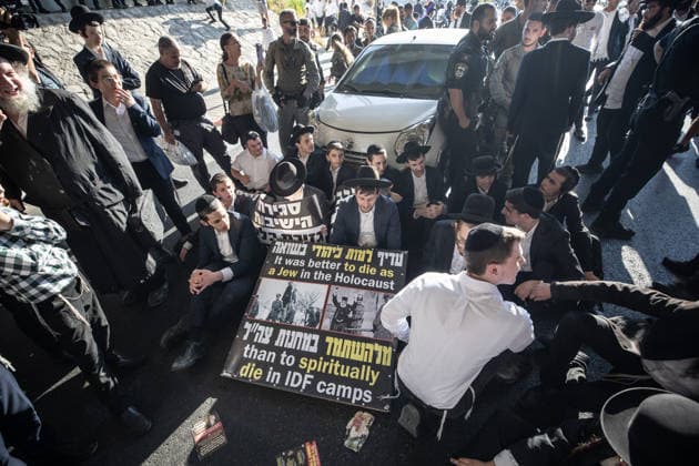 Haredi Jews protest mandatory military service in Bnei Brak BNEI BRAK, ISRAEL - AUGUST 24: Ultra-Orthodox Jews, known as Haredim, gather to protest mandatory military service, blocking one of the city s main roads in Bnei Brak near Tel Aviv, Israel on August 24, 2026. The protesters, wearing traditional black suits, white shirts and black hats, demonstrate against a government bill that proposes fines and other sanctions for those refusing military service. Mostafa Alkharouf Anadolu Bnei Brak Israel. Editorial use only. Please get in touch for any other usage.  Copyright: x2026xAnadoluxMostafaxAlkharoufx