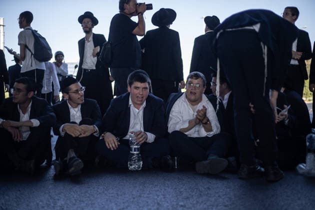 Haredi Jews protest mandatory military service in Bnei Brak BNEI BRAK, ISRAEL - AUGUST 24: Ultra-Orthodox Jews, known as Haredim, gather to protest mandatory military service, blocking one of the city s main roads in Bnei Brak near Tel Aviv, Israel on August 24, 2026. The protesters, wearing traditional black suits, white shirts and black hats, demonstrate against a government bill that proposes fines and other sanctions for those refusing military service. Mostafa Alkharouf Anadolu Bnei Brak Israel. Editorial use only. Please get in touch for any other usage.  Copyright: x2026xAnadoluxMostafaxAlkharoufx