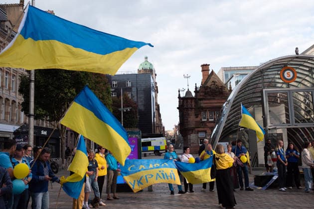 August 24, 2026, Glasgow, Scotland, UK: Members of Scotlands Ukrainian community gathered in Glasgow to mark the 35th anniversary of Ukraines independence. The event included a minutes silence and shared prayer, speeches, the formation of a large human Ukrainian flag, and the international Chain of Unity and The Free World Gathering, connecting Ukrainians and supporters of Ukraine in cities around the world. Glasgow UK - ZUMAs357 20260824_zip_s357_012 Copyright: xCameronxScottx