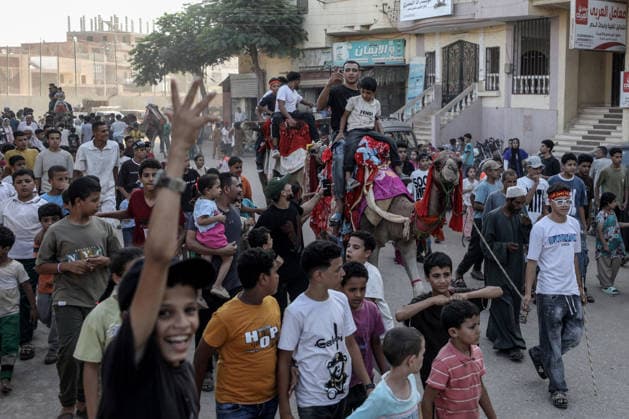 Mawlid al-Nabi in Egypt MONUFIA, EGYPT - AUGUST 24: Egyptians of all ages walk through the streets of Shama village in Monufia, Egypt, accompanied by camels and chanting hymns as part of a long-standing tradition marking Mawlid Night, on August 24, 2026. Mohamed Elshahed Anadolu Monufia Egypt. Editorial use only. Please get in touch for any other usage.  Copyright: x2026xAnadoluxMohamedxElshahedx