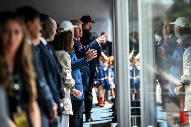 August 24, 2026, Washington, Dc, United States: U.S. President Donald Trump, right, chats with Roger Penske, owner of the Penske Motorsports, center, before the start of the Freedom 250 Grand Prix Race, August 23, 2026 in Washington, D.C. Washington United States - ZUMAp138 20260824_zaa_p138_039 Copyright: xDanielxTorok WhitexHousex