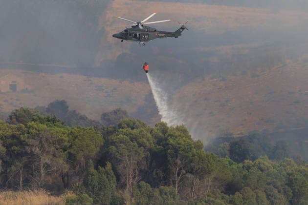 Aerial firefighting efforts battle forest fire near Trapani in Sicily, Italy TRAPANI, ITALY - AUGUST 24: Firefighting aircraft and helicopters battle a forest fire on the slopes of Mount Polizo near Trapani on the Italian island of Sicily, on August 24, 2026. Emergency teams launched an aerial operation, deployed three helicopters and two firefighting planes to contain the blaze and prevent it from spreading across the forested terrain. Alberto Lo Bianco Anadolu Trapani Italy. Editorial use only. Please get in touch for any other usage.  Copyright: x2026xAnadoluxAlbertoxLoxBiancox