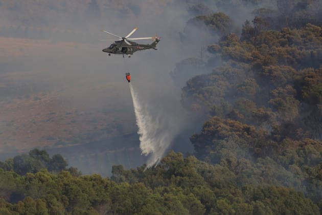 Aerial firefighting efforts battle forest fire near Trapani in Sicily, Italy TRAPANI, ITALY - AUGUST 24: Firefighting aircraft and helicopters battle a forest fire on the slopes of Mount Polizo near Trapani on the Italian island of Sicily, on August 24, 2026. Emergency teams launched an aerial operation, deployed three helicopters and two firefighting planes to contain the blaze and prevent it from spreading across the forested terrain. Alberto Lo Bianco Anadolu Trapani Italy. Editorial use only. Please get in touch for any other usage.  Copyright: x2026xAnadoluxAlbertoxLoxBiancox
