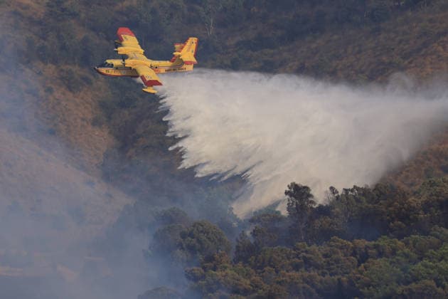 Aerial firefighting efforts battle forest fire near Trapani in Sicily, Italy TRAPANI, ITALY - AUGUST 24: Firefighting aircraft and helicopters battle a forest fire on the slopes of Mount Polizo near Trapani on the Italian island of Sicily, on August 24, 2026. Emergency teams launched an aerial operation, deployed three helicopters and two firefighting planes to contain the blaze and prevent it from spreading across the forested terrain. Alberto Lo Bianco Anadolu Trapani Italy. Editorial use only. Please get in touch for any other usage.  Copyright: x2026xAnadoluxAlbertoxLoxBiancox