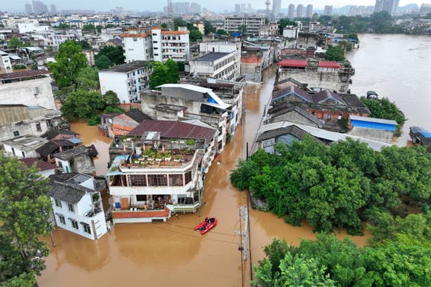 LONGZHOU, CHINA - AUGUST 24: Rescue boats enter flooded areas as water levels rise in the Zuojiang River section of Longzhou county on August 24, 2026 in Longzhou, Guangxi Zhuang Autonomous Region of China. Heavy rainfall brought by Typhoon Yutu and upstream water flow caused flooding in parts of the urban area, while local authorities continue monitoring water conditions and carrying out rescue operations.  Copyright: xChinaxNewsxServicex 111661931569