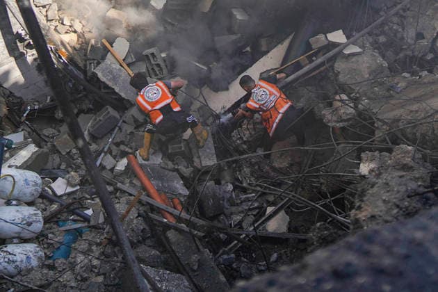 Water Desalination Plant Strike Gaza City A civil defense worker sprays water onto smoking rubble while another worker searches the debris at a destroyed water desalination plant in the Sheikh Radwan neighborhood in Gaza City, Gaza Strip, on August 24, 2026. The facility was targeted after an Israeli army officer called a local resident to issue an evacuation warning for the area near the Ahli Club, resulting in no reported casualties. Gaza Gaza Strip Palestinian Territories Copyright: xMohammedxAlxQumsanx