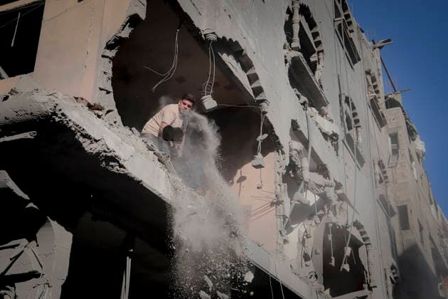 Israeli Strikes Beach Camp Gaza City A man clears debris from a heavily damaged building at the site of an Israeli strike in Gaza City, Gaza Strip, on August 24, 2026. Israeli warplanes struck the site following an evacuation warning to residents, completely destroying the Asqalan Prayer Hall and reportedly damaging nearby buildings. Gaza Gaza Strip Palestine Territories Copyright: xMohammedxMxSkaikx