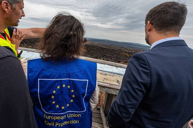 Walloon Minister President Adrien Dolimont and EU Commissioner for Equality, Preparedness and Crisis Management Hadja Lahbib pictured at a visit at the Botrange panorama deck, in Waimes, on Tuesday 25 August 2026. European commissionner Lahbib visit several sites regarding the fire in the Hautes Fagnes (Hugh Fens) wich started on August 14th with 3000 hectares (on a total of 4500) impacted in the nature reserve.  EMILExWINDAL 184245086