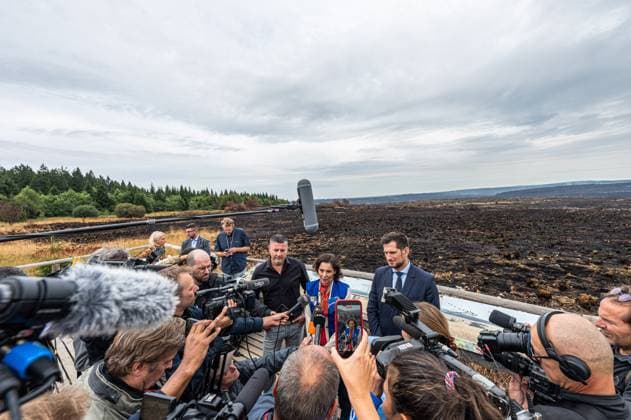 Walloon Minister President Adrien Dolimont and EU Commissioner for Equality, Preparedness and Crisis Management Hadja Lahbib pictured at a visit at the Botrange panorama deck, in Waimes, on Tuesday 25 August 2026. European commissionner Lahbib visit several sites regarding the fire in the Hautes Fagnes (Hugh Fens) wich started on August 14th with 3000 hectares (on a total of 4500) impacted in the nature reserve.  EMILExWINDAL 184245103