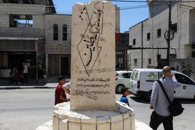Far-right Israeli lawmaker smashes Palestinian memorial in West Bank NABLUS, WEST BANK, PALESTINE - AUGUST 25: Palestinians inspect the damage to a Palestinian memorial, which was smashed with a sledgehammer by far-right Israeli lawmaker Zvi Sukkot and those accompanying him, who entered the village of Madama near Nablus in the northern West Bank under the protection of Israeli soldiers, on August 25, 2026. Far-right lawmaker Sukkot and those accompanying him raided the village of Madama in Nablus in the early morning under the protection of Israeli soldiers. Far-right Israeli lawmaker Zvi Sukkot along with three people accompanying him, smashed the memorial with sledgehammers and also recorded the others attacking the memorial with his pho  Copyright: x2026xAnadoluxNedalxEshtayahx
