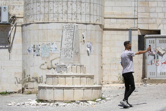 Far-right Israeli lawmaker smashes Palestinian memorial in West Bank NABLUS, WEST BANK, PALESTINE - AUGUST 25: Palestinians inspect the damage to a Palestinian memorial, which was smashed with a sledgehammer by far-right Israeli lawmaker Zvi Sukkot and those accompanying him, who entered the village of Madama near Nablus in the northern West Bank under the protection of Israeli soldiers, on August 25, 2026. Far-right lawmaker Sukkot and those accompanying him raided the village of Madama in Nablus in the early morning under the protection of Israeli soldiers. Far-right Israeli lawmaker Zvi Sukkot along with three people accompanying him, smashed the memorial with sledgehammers and also recorded the others attacking the memorial with his pho  Copyright: x2026xAnadoluxNedalxEshtayahx