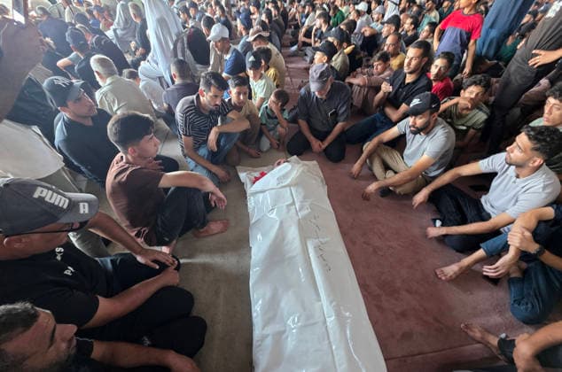Palestinians Bury Three People in Khan Younis Palestinians attend the funeral of three people in Khan Younis, in the southern Gaza Strip, on August 25, 2026. Two died from wounds sustained in previous Israeli strikes, while the third was killed in an Israeli strike the previous evening. Photo by Tariq Mohammad APA Images Khan Yunis Gaza Strip Palestinian Territory 250826_Khan_Yunis_TM_04(20) Copyright: xapaimagesxTariqxMohammad xapaimagesx