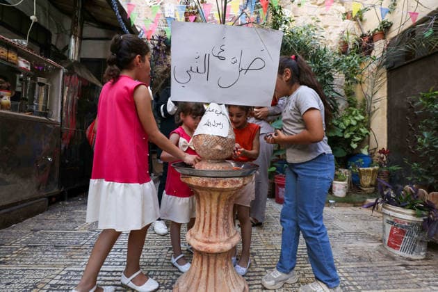 Nablus marks Mawlid al-Nabi with decorations and street celebrations NABLUS, WEST BANK - AUGUST 25: Streets and roads are decorated as Palestinians gather at shopping areas and distribute sweets to mark Mawlid al-Nabi, the anniversary of the birth of Prophet Muhammad, in Nablus, West Bank, Palestine on August 25, 2026. Nedal Eshtayah Anadolu Nablus West Bank. Editorial use only. Please get in touch for any other usage.  Copyright: x2026xAnadoluxNedalxEshtayahx