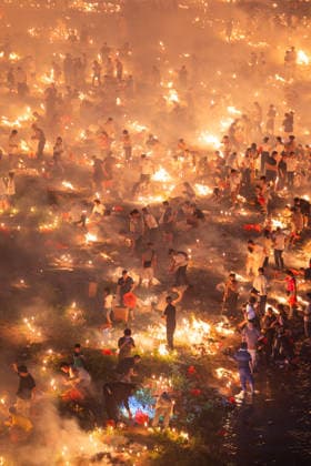 KAILI, CHINA - AUGUST 25: People burn paper offerings in designated areas to pay tribute to their departed loved ones ahead of the Zhongyuan Festival (Ghost Festival) on August 25, 2026 in Kaili, Guizhou Province of China. The Ghost Festival, also known as Zhongyuan Festival, is a traditional festival for paying respect to the dead.  Copyright: xVCGx 111662157019