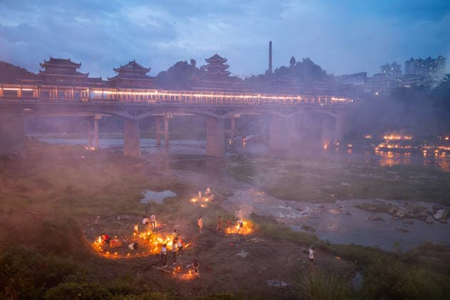 KAILI, CHINA - AUGUST 25: People burn paper offerings in designated areas to pay tribute to their departed loved ones ahead of the Zhongyuan Festival (Ghost Festival) on August 25, 2026 in Kaili, Guizhou Province of China. The Ghost Festival, also known as Zhongyuan Festival, is a traditional festival for paying respect to the dead.  Copyright: xVCGx 111662157014