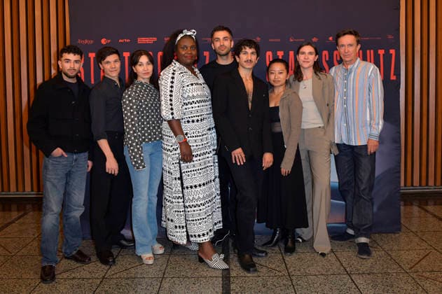 Ali Reza Ahmadi, Sebastian Urzendowsky, Kathrin Angerer, Mercy Dorcas Otieno, Jorgo Narjes, Faraz Shariat, Chen Emilie Yan, Paulina Lorenz und Arnd Klawitter beim Special Screening des Kinofilms Staatsschutz im Kino International. Berlin, 25.08.2026