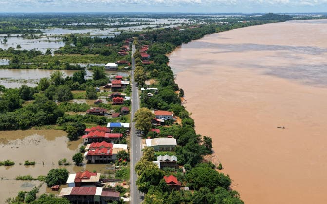 (260826) -- KRATIE, Aug. 26, 2026 -- An aerial drone photo taken on Aug. 24, 2026 shows an area affected by the flooding of the Mekong River in Kratie province, Cambodia. The flooding of the Mekong River has affected 13,688 families across four Cambodian provinces, forcing 1,551 families to evacuate to higher ground, a disaster control spokesperson said Tuesday. Soth Kim Kolmony, spokesperson for the National Committee for Disaster Management (NCDM), said Kratie, Tboung Khmum, Stung Treng, and Kampong Cham provinces have faced severe flooding since last Friday, triggered by the aftermath of Typhoon Saudel. (Photo by Xinhua) CAMBODIA-KRATIE-MEKONG RIVER-FLOOD Nitola 