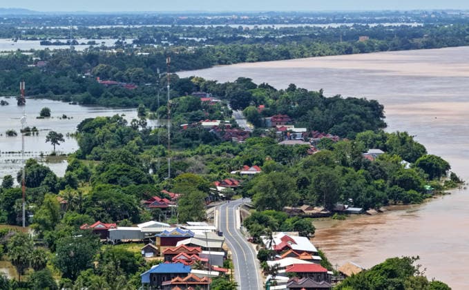 (260826) -- KRATIE, Aug. 26, 2026 -- An aerial drone photo taken on Aug. 24, 2026 shows an area affected by the flooding of the Mekong River in Kratie province, Cambodia. The flooding of the Mekong River has affected 13,688 families across four Cambodian provinces, forcing 1,551 families to evacuate to higher ground, a disaster control spokesperson said Tuesday. Soth Kim Kolmony, spokesperson for the National Committee for Disaster Management (NCDM), said Kratie, Tboung Khmum, Stung Treng, and Kampong Cham provinces have faced severe flooding since last Friday, triggered by the aftermath of Typhoon Saudel. (Photo by Xinhua) CAMBODIA-KRATIE-MEKONG RIVER-FLOOD Nitola 