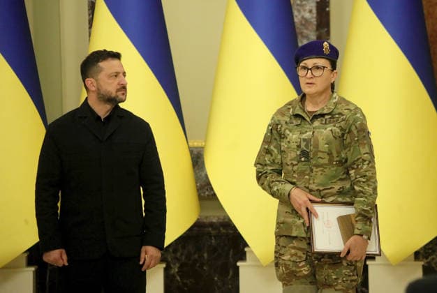 Senior medical operating nurse of the medical company of the 1st Corps of the National Guard of Ukraine Azov Nadiia Yarish (R) accepts the National Legend of Ukraine award from President of Ukraine Volodymyr Zelenskyy during a ceremony at the Mariinskyi Palace, Kyiv, Ukraine, August 25, 2026. Established in 2021, the President of Ukraine’s National Legend of Ukraine award honours individuals who have contributed to the establishment of an independent Ukraine, the defence of the country and service to the Ukrainian people, the development of the national economy, science, education, culture, the arts, sport and health care, as well as active charitable and civic activities. This year, 18 recipients included military personnel, artists, mus  Copyright: xYuliiaxOvsiannikovax