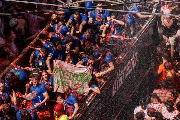 La Tomatina Celebration in Bunol, Valencia, 2026 Several participants in the La Tomatina festival in Bunol throw tomatoes from a truck at the rest of the crowd on August 26, 2026, in Bunol, Valencia, Valencian Community, Spain. La Tomatina is always held on the last Wednesday of August, as part of Bunol’s festival week, and involves participants throwing tomatoes at one another. Seven trucks were needed to transport the 150,000 kilograms of tomatoes thrown during this unique battle, which this year celebrates its 79th anniversary. AUGUST 26, 2026 FESTIVAL TRADITION CULTURE Bunol, Valencia, Valencian Community Bunol, Valencia, Valencian Community, Spain  Copyright: xRoberxSolsonax 7732773
