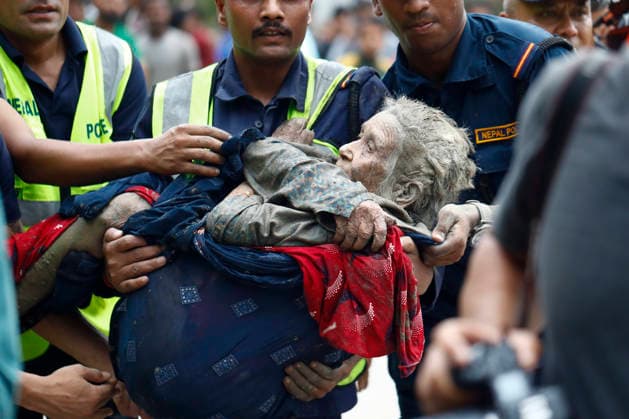 August 26, 2026, Nuwakot, Nepal: An elderly woman is rescued from buildings and infrastructure that were damaged along the swollen Trishuli River following a massive flash flood triggered by an avalanche of ice and rock in the upper Lhende River on the Tibetan side, in Nuwakot district, Nepal, on Wednesday, August 26, 2026. The sudden flood swept through communities along the Bhote Koshi and Trishuli river systems, destroying homes, roads and bridges and leaving widespread devastation downstream. Nuwakot Nepal - ZUMAg200 20260826_zap_g200_016 Copyright: xSkandaxGautamx