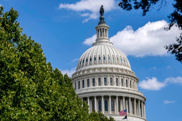 The American flag is lowered to half staff over the U.S. Capitol to honor the late country music singer and philanthropist Dolly Parton in Washington, DC on Wednesday, August 26, 2026. Parton died yesterday at the age of 80 after a brief battle with cancer.  WAP20260826341 BONNIExCASH