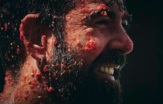(260827) -- BEIJING, Aug. 27, 2026 -- A reveller is pictured during the annual tomato fight (La Tomatina) in Bunol near Valencia, Spain, Aug. 26, 2026. (Photo by Xinhua) XINHUA PHOTOS OF THE DAY PabloxMorano 