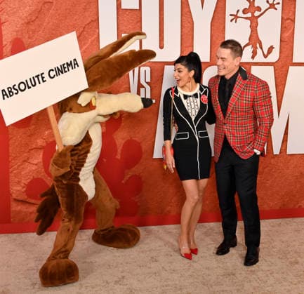 Cast member John Cena and his wife Shay Shariatzadeh attend Ketchup Entertainment s premiere of the animated quirky comedy Coyote vs. Acme at the Westwood Village Theater in Los Angeles on Wednesday, August 26, 2026. Storyline: A story set in the ACME warehouse, the manufacturer of anything and everything used by the Looney Tunes characters.  LAP2026082603 JIMxRUYMEN