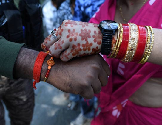 August 28, 2026, Srinagar, Jammu And Kashmir, India: A hindu woman ties Rakhi or a colorful band on the wrist of the CRPF personnel at the Shankarachya temple on the occasion of Raksha Bandhan festival in Srinagar. Srinagar India - ZUMAz120 20260828_zip_z120_017 Copyright: xBasitxZargarx