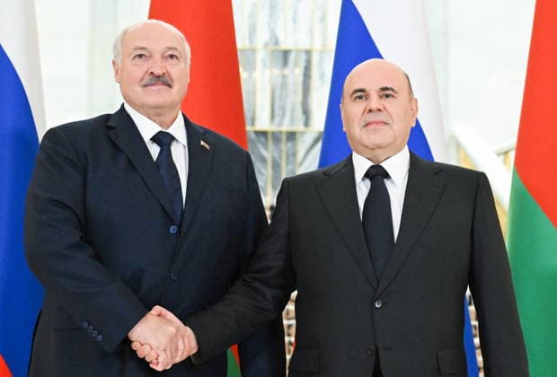 RUSSIA, MOSCOW - AUGUST 28, 2026: Russia s Prime Minister Mikhail Mishustin (R) and Belarus PresidentAlexander Lukashenko shake hands during a meeting at the House of the Russian Government. Alexander Miridonov POOL TASS  96737757
