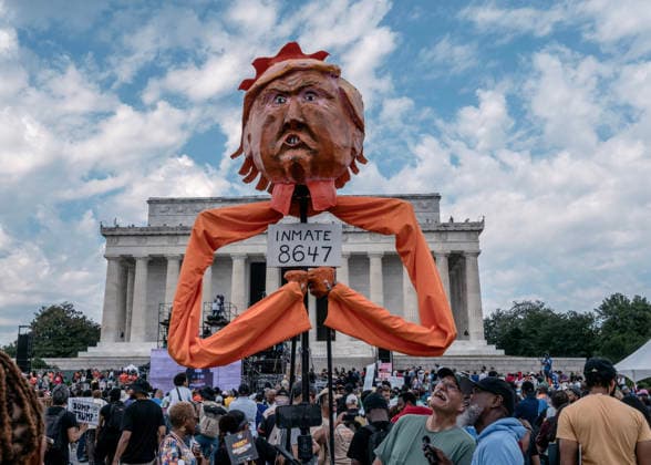 August 28, 2026, Washington, Distict Of Columbia, U.S.A: A demonstrator holds an effigy of U.S. President Donald Trump wearing a crown and a sign that reads, Ã¢â‚¬oeInmate 8647,Ã¢â‚¬Â? while attending the Ã¢â‚¬oeMarch on Washington: Defend the VoteÃ¢â‚¬Â? rally at the Lincoln Memorialin Washington, DC, on August 28, 2026. The rally, organized by the National Action Network, marks the 63rd anniversary of the 1963 March on Washington, where Rev. Martin Luther King Jr. delivered his historic Ã¢â‚¬oeI Have a DreamÃ¢â‚¬Â? speech. Thousands of demonstrators are expected to gather to call attention to voting rights ahead of NovemberÃ¢â‚¬â ¢s midterm elections. Washington U.S.A - ZUMAr125 20260828_fap_r125_005 Copyright: xProbalxRashidx