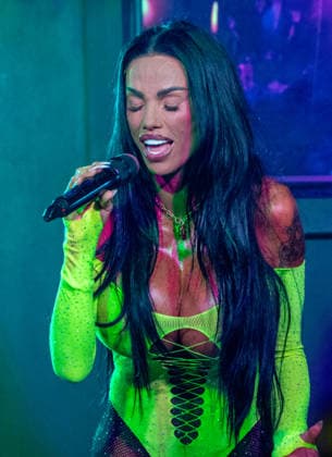 Kate Price at Manchester Village Pride 2026 in Manchester, UK - 28 Aug 2026 Model turned singer, Katie Price commands the stage in a vibrant yellow bodysuit during a provocative performance at Via Manchester on Canal Street for the inaugural Manchester Village Pride 2026. The reality TV icon teased the packed crowd, playing with her hair and striking dramatic poses in the sweltering heat of the venue, pausing occasionally for drags from her vape and sips of her drink. Delivering an interactive set, Price invited excited members of the audience onto the stage to sing along with her, leaving several fans visibly emotional as they shared the microphone with the star. Manchester United Kingdom Copyright: xGaryxRobertsx xSOPAxImagesx GROBERTS-43