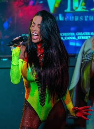August 28, 2026, Manchester, United Kingdom: Model turned singer, Katie Price commands the stage in a vibrant yellow bodysuit during a provocative performance at Via Manchester on Canal Street for the inaugural Manchester Village Pride 2026. The reality TV icon teased the packed crowd, playing with her hair and striking dramatic poses in the sweltering heat of the venue, pausing occasionally for drags from her vape and sips of her drink. Delivering an interactive set, Price invited excited members of the audience onto the stage to sing along with her, leaving several fans visibly emotional as they shared the microphone with the star. Manchester United Kingdom - ZUMAs197 20260828_aaa_s197_160 Copyright: xGaryxRobertsx