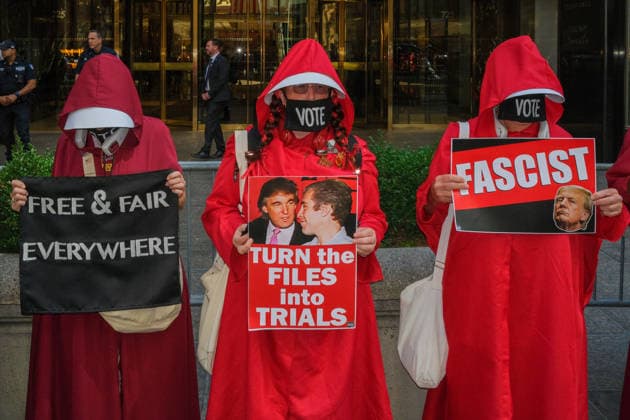 August 29, 2026, New York, New York, USA: In front of Trump Tower the National Handmaiden Army and their visual imagery in NYC silently protesting.Donald Trump, the lack of womens rights, government policies, reproductive rights, getting out the Vote,.gender discrimination and body autonomy. They are striking symbols of political defiance and solidarity. New York USA  - ZUMAh156 20260829_znp_h156_005 Copyright: xMiloxHessx
