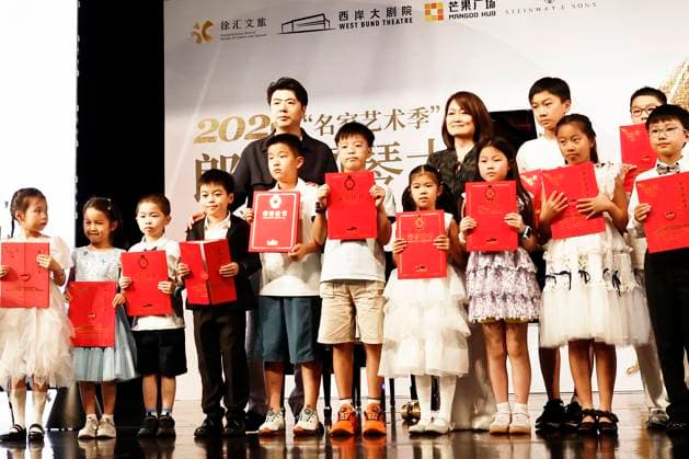 SHANGHAI, CHINA - AUGUST 29: Pianist Lang Lang poses for a photo with youth students during a public piano masterclass at the West Bund Grand Theatre on August 29, 2026 in Shanghai, China. The event marked the opening of the 2026 Xuhui Famous Artists Season, featuring interactions between Lang Lang and eight young students.  Copyright: xChinaxNewsxServicex 111662896144
