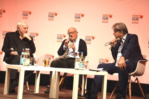 Filmgespraech Film Rückkehr nach Montauk . Dr Michael Goetz Festivalintendant Volker Schlöndorff Regisseur Festival Ehrenpreistraeger 2026 Ruediger Suchsland Gespraechsleiter Ludwigshafen 28.08.2026 am Rheinufer 22.Festival des Deutschen Films 2026 Foto Ludwigshafen